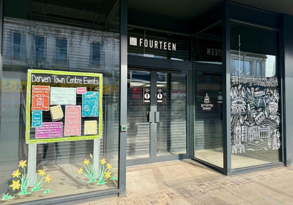New #shopdarwen window art “springs” up at Fourteen Market Street