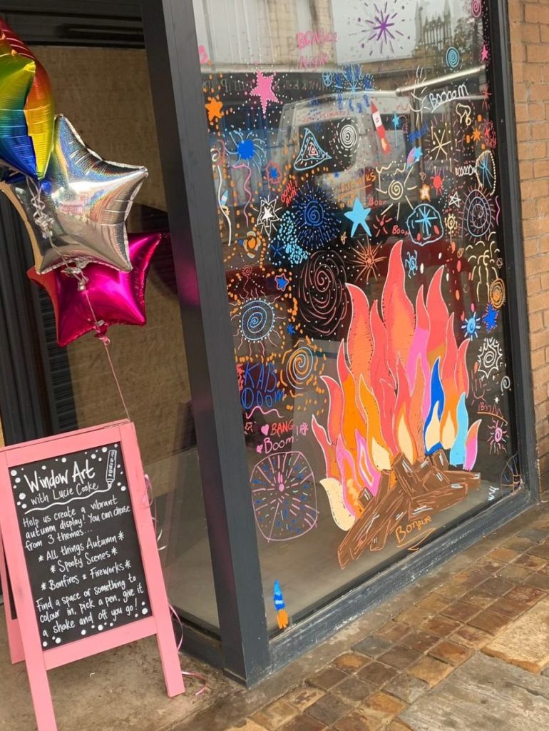 Year 6 class celebrate all things autumn with Darwen Town Centre window art