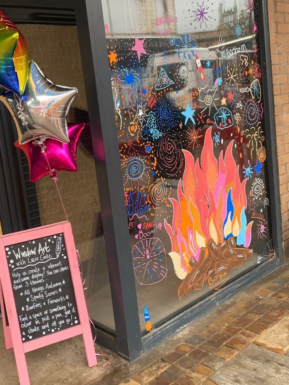 Year 6 class celebrate all things autumn with Darwen Town Centre window art